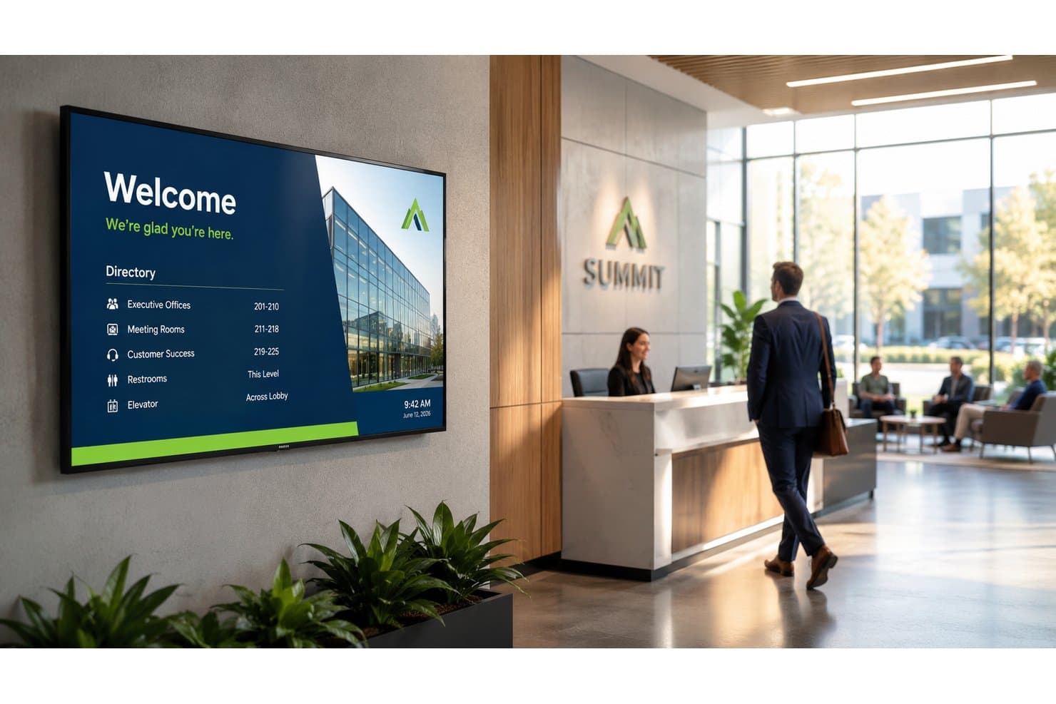 Écran d’affichage numérique montrant un répertoire de bienvenue avec les numéros des salles de bureau dans le hall d’accueil d’une entreprise.
