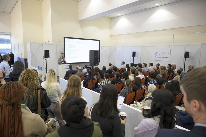 Attendees listening to a speaker during a Medical Technology UK presentation