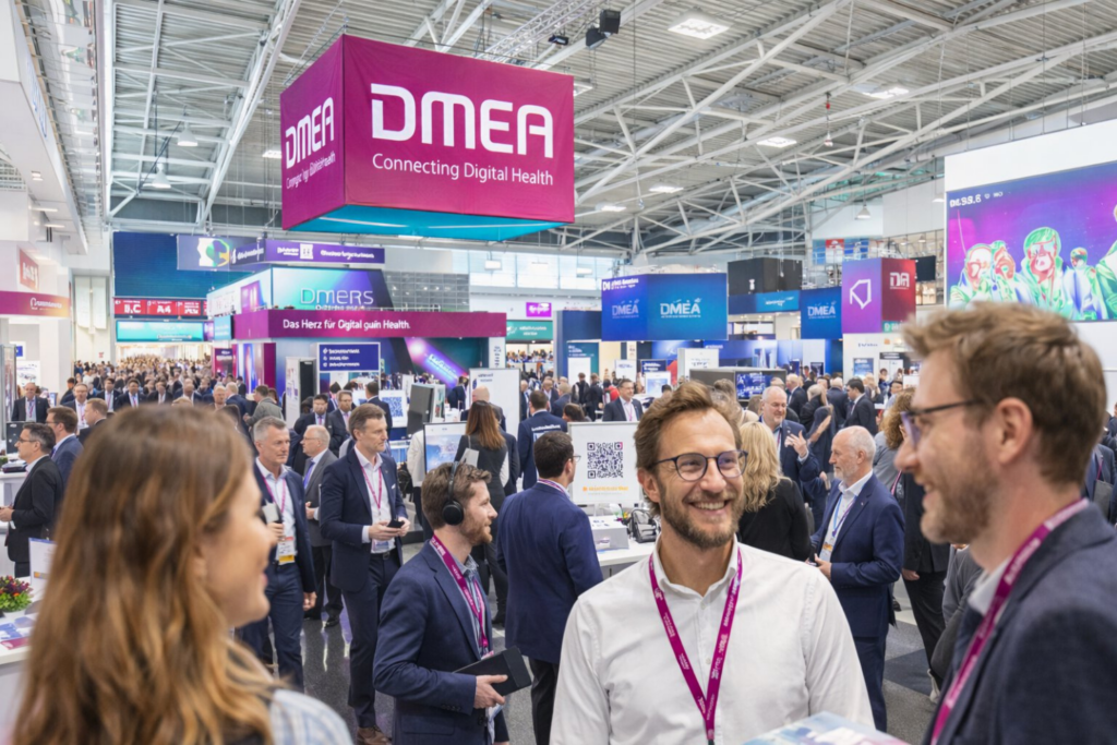 Healthcare professionals networking at the DMEA digital health exhibition