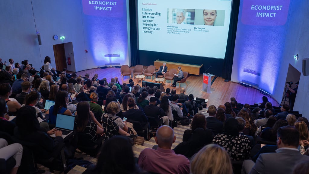 Summit attendees listening to insights from speakers at the AI in Health Summit