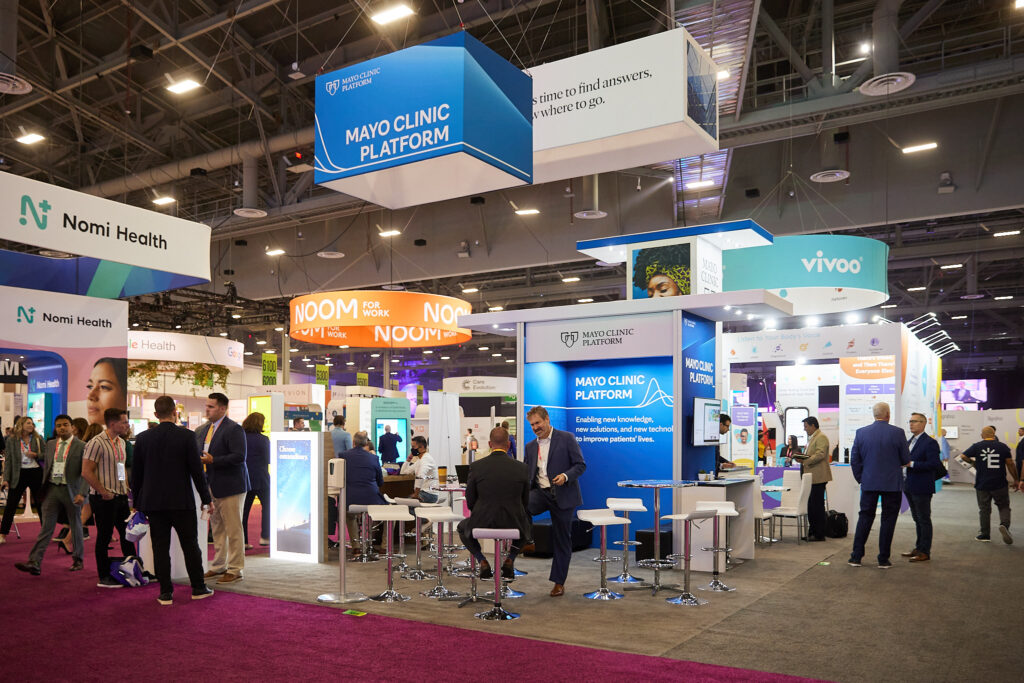 Attendees networking at HLTH conference