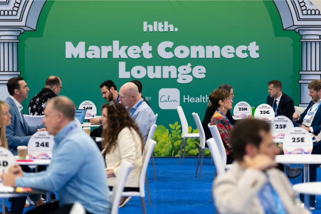 Attendees meeting and networking in the Market Connect Lounge at the HLTH USA conference