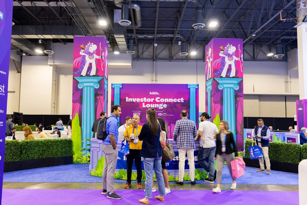Conference attendees gathered around the Investor Connect Lounge area at HLTH USA