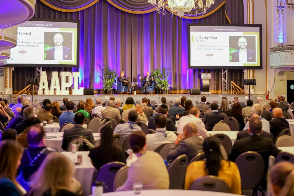 Conference attendees watching a keynote session at AAPL Annual Leadership Conference