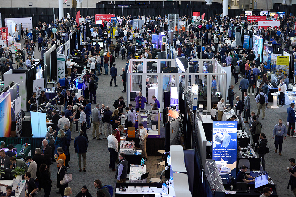 Participants networking around busy lobby at MEDevice Boston