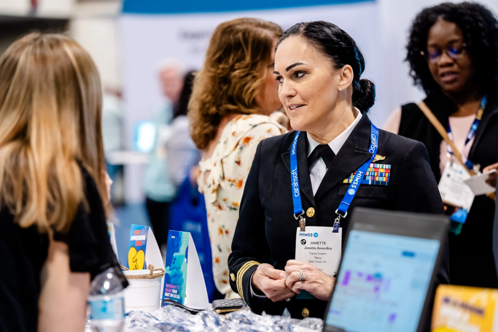 Exhibitor showcasing her product at HIMSS Global Health Conference & Exhibition