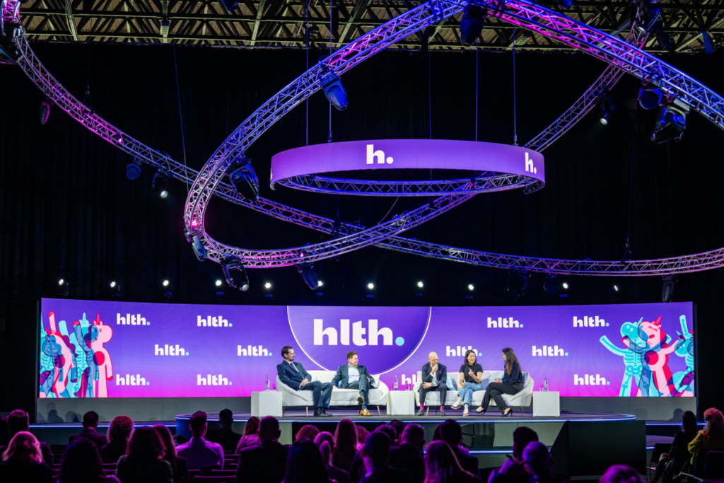 Panel discussion taking place on the main stage at HLTH USA