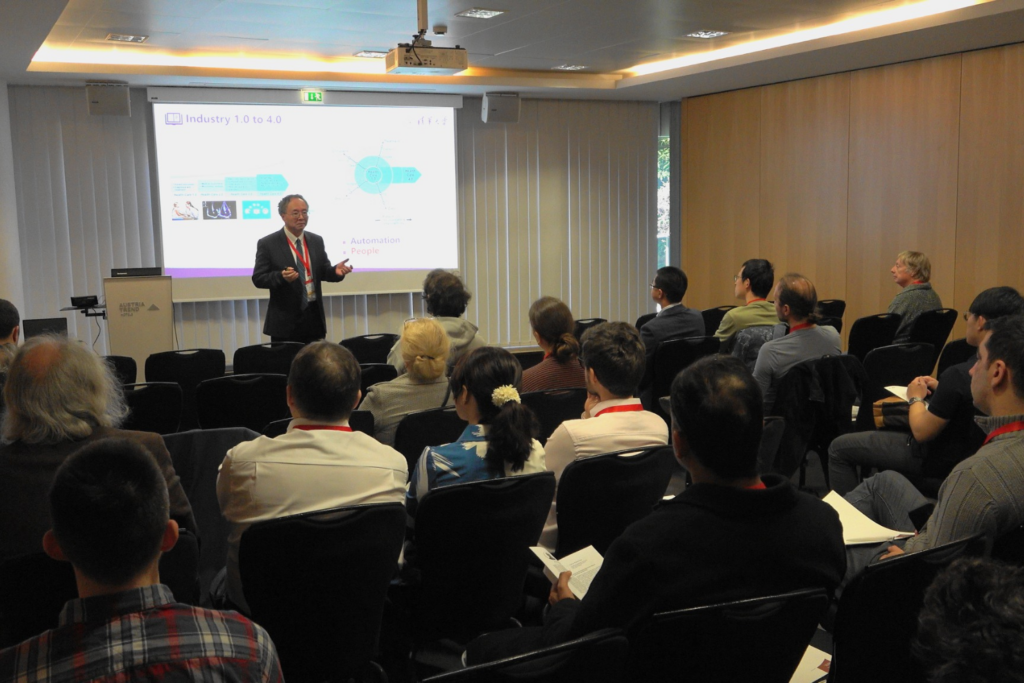 Speaker presenting at the AiMH 2025